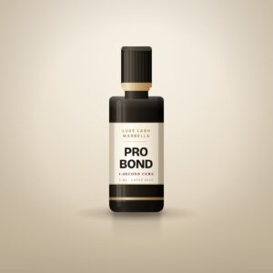 Black 5 ml bottle of Luxe Lash Marbella Pro Bond lash adhesive with a gold-banded cap and cream label on a warm cream background